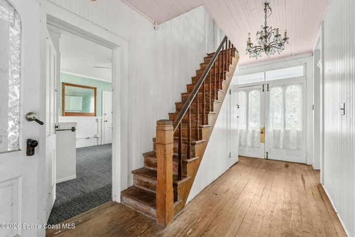leading to second floor bedrooms and west wing