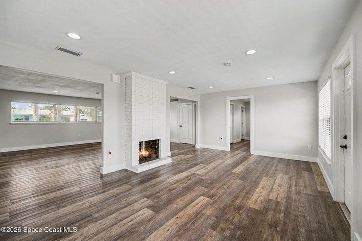 Family room with fireplace and access to the back deck