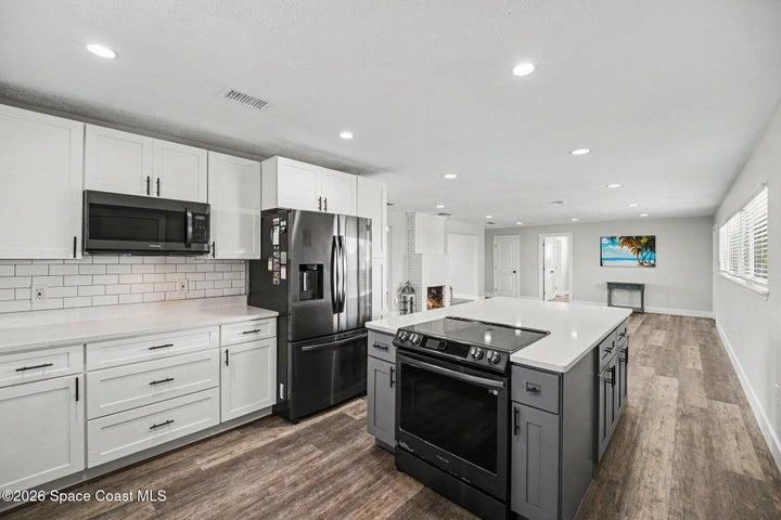 Kitchen with stainless steel appliances and tile backplash