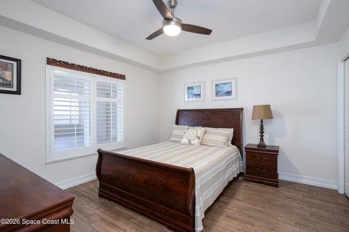 Large guest room with custom features is adjacent to the gorgeous guest bath.