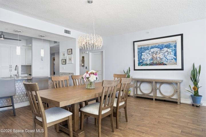 No carpeting. Wood look tile throughout this stunning condo. Upgraded lighting throughout.