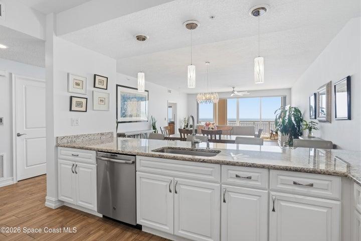 Upgraded pendant lighting. stainless steel appliances.