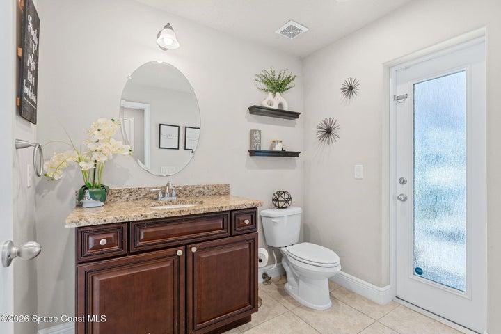 Guest room downstairs leading out to the pool area