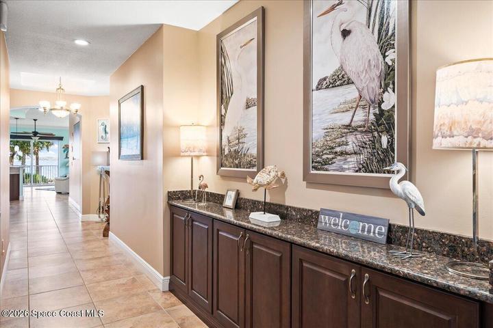 The entry hall provides roaming access to beautiful storage, art nooks and 3 of the 4 bedrooms in this larger than average sized condo, along with a beautiful view of the Indian River at the end of your stroll.