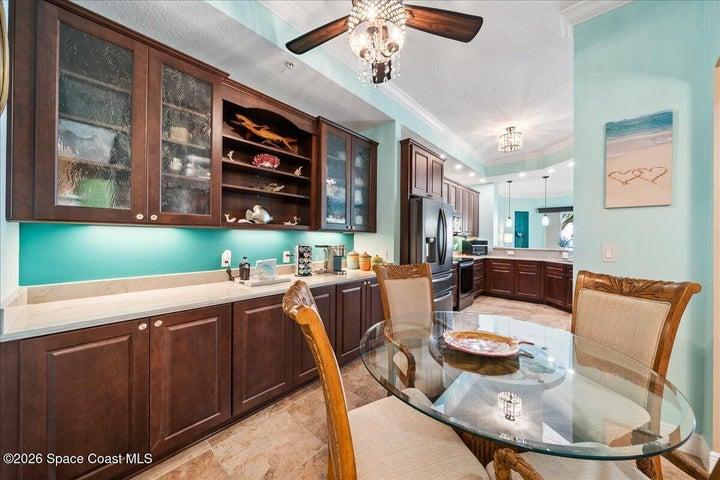 Enjoy casual meals in the kitchen nook with glass front cabinetry to store your entertaining items and lower storage for your hard working smaller electric appliances.