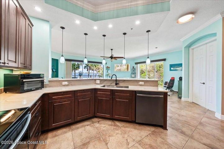 Quartz Countertops with breakfast bar open to the great room and Indian River Views.