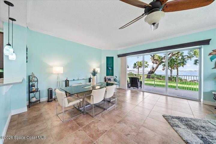 Formal Dining (current use) with views and easy access to wraparound porch with gate to "yard" and pool.
