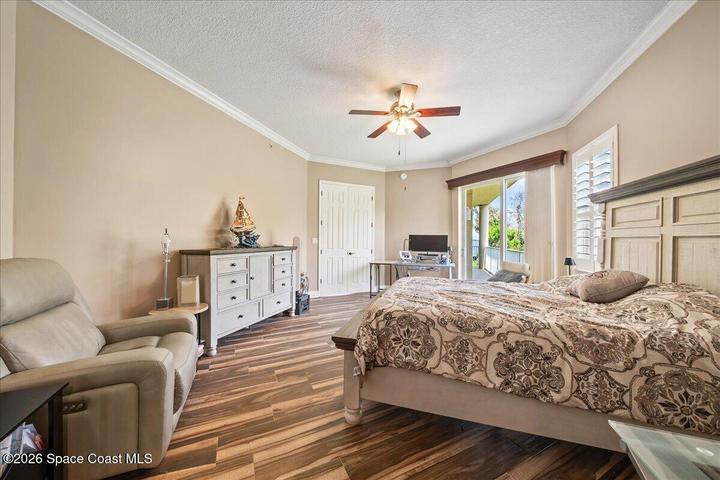 The Primary Bedroom is spacious enough for dressers, desks, seating and more. It also includes crown molding, plantation shutters and dual walk in closets with beautiful wooden closet system in each.