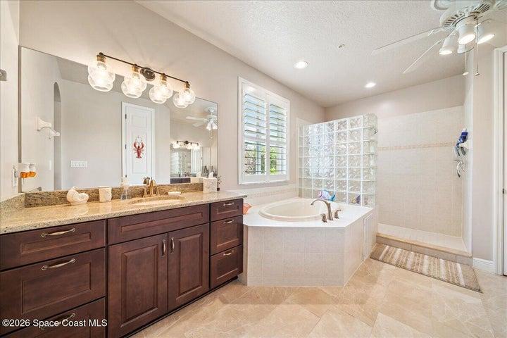 Ensuite bath with dual sinks, seperate tub, shower and water closet make it roomy for sharing.