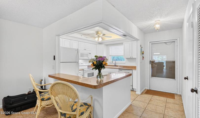 Open-concept kitchen featuring included appliances