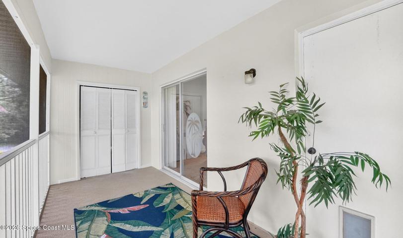 Screened-in balcony wth a storage closet