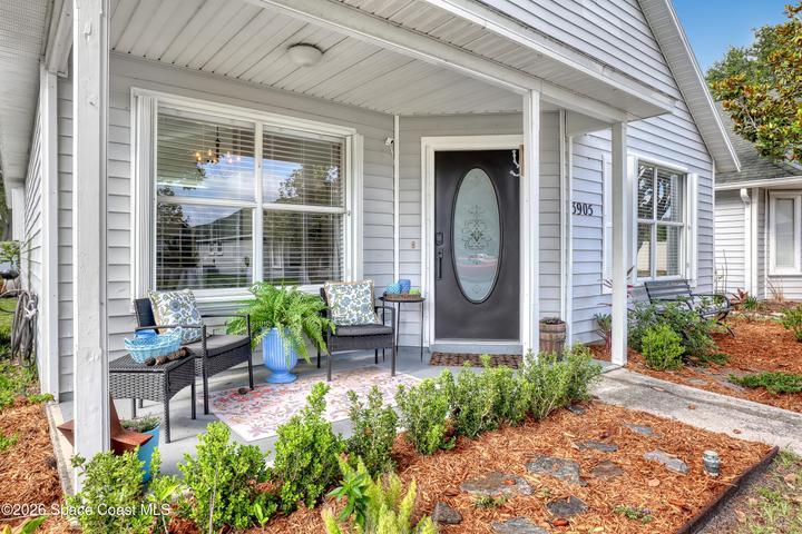 Relax on your front porch with fresh landscaping