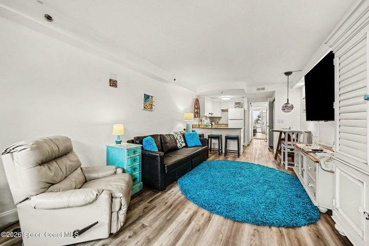 living room with a convertible couch that makes a bed