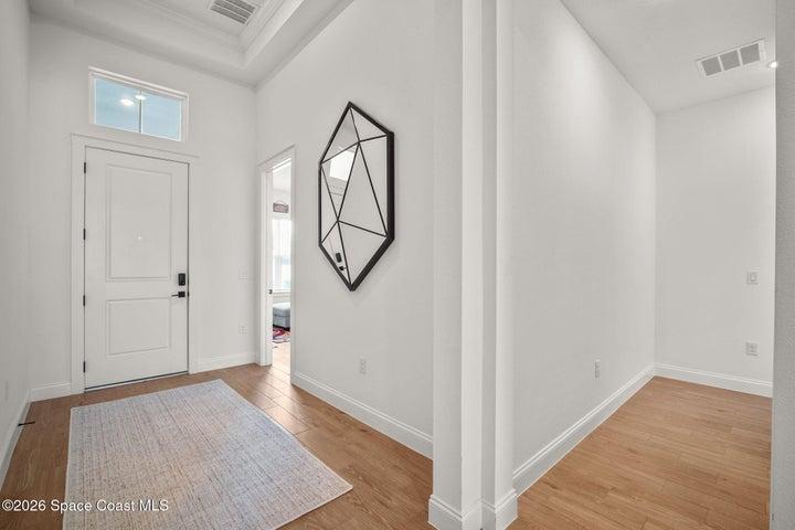 Light-filled hallway headed to any of the 3 extra bedrooms/office