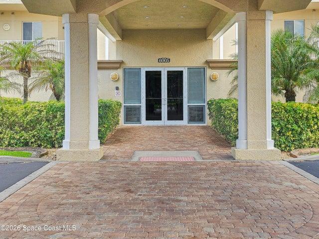 Entry to the elevator and mail lobby under the covered portico entry.