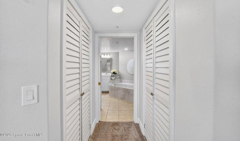 Leading to the Primary bathroom. Two walk-in closets