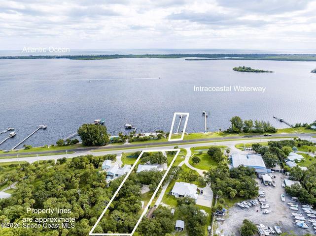 Includes property on Indian River navigable intercoastal with 300' PRIVATE dock and 2 lifts