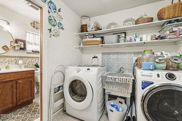 laundry with office and half bath off of it