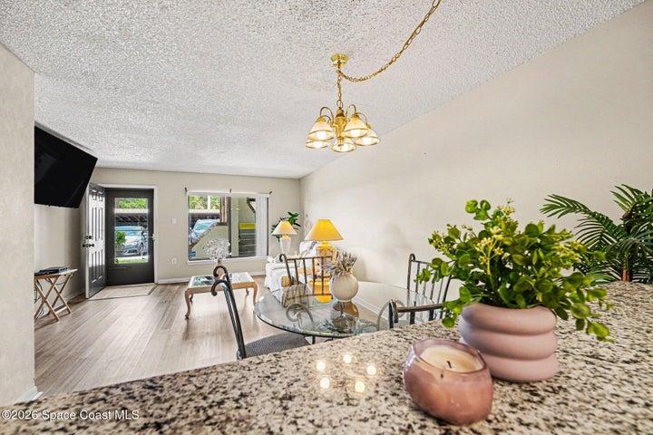 Kitchen has updated quartz countertops. Because of the open floor plan, everybody is part of the conversation from kitchen to dining and living room.