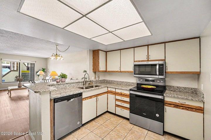 Main kitchen has quartz countertops and plenty of cabinetry.