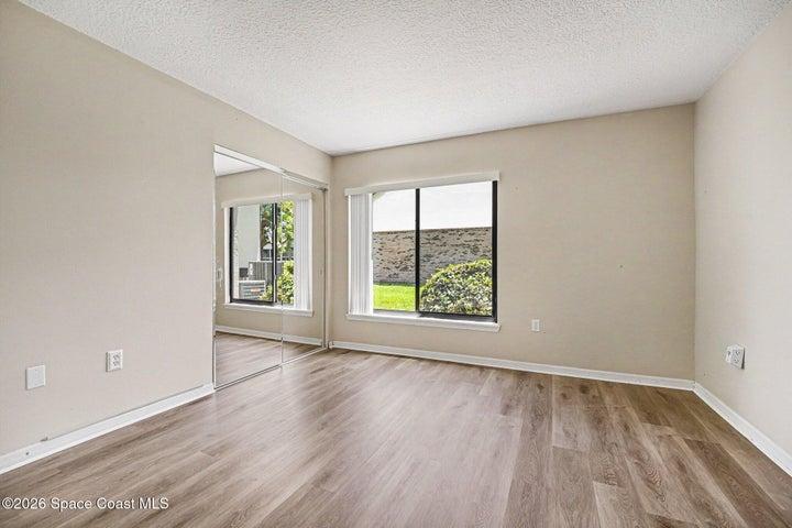 First of the two bedrooms. This is the primary. Both bedrooms have updated luxury vinyl wood flooring. No carpets!