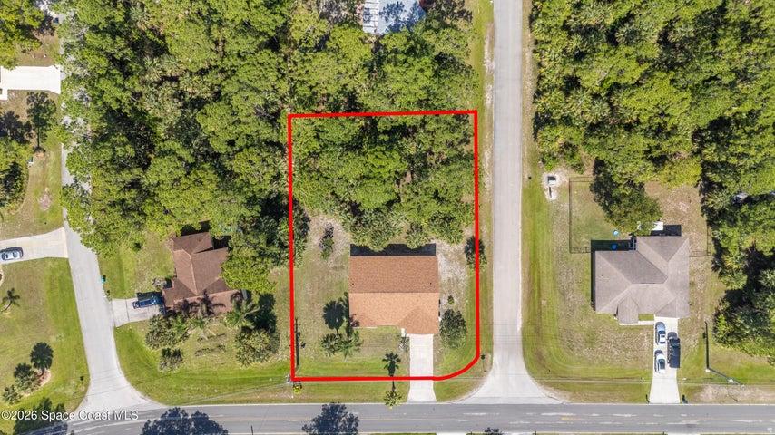 1/2 acre. Most of the underbrush on the back lot has been cleared.