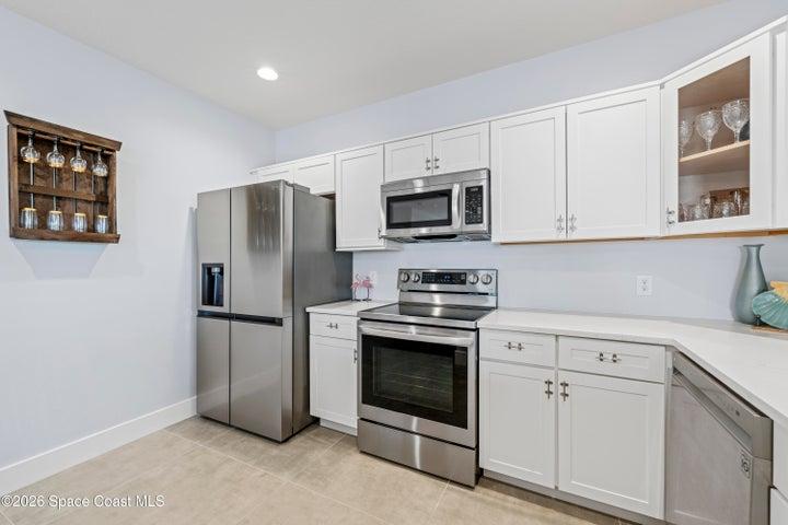 Flamingo units kitchen - very spacious, white cabinetry, soft close and beautiful quartz counters