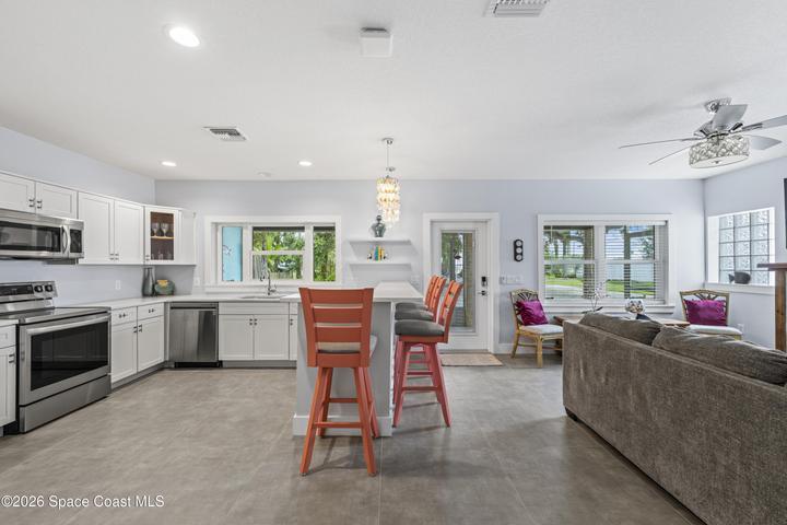 Open and bright, opens to screened lanai, perfect for entertaining