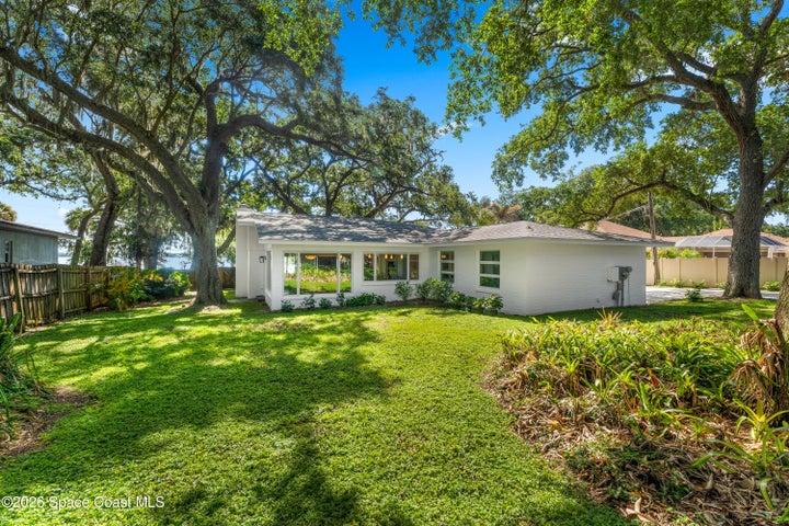 Large Park-Like Back Yard Beneath Shade Trees