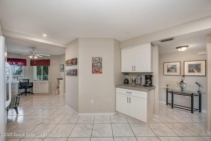 Updated Kitchen with White Soft Close Cabinetry, Natural Stone Countertops, Dual Sink, Fridgeadare Electic Oven/Range, Dishwasher, Microwave, & Refridgerator/Freezer