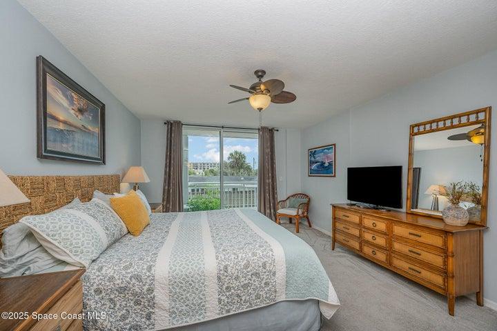 Spacious Primary Bedroom with Walk-in Dual Closets, Slider to Balcony, & En-Suite Bathroom with Dual Sinks, Walk-In Shower, & Separate Soaking Tub.