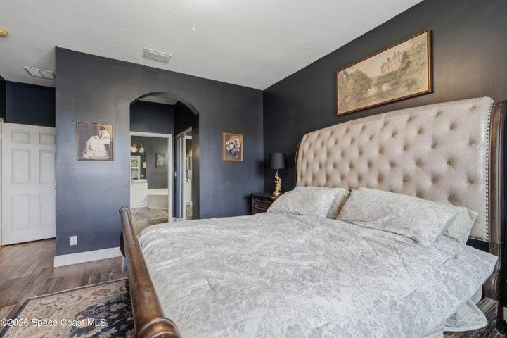 Primary Suite leading to dual closets and the ensuite.