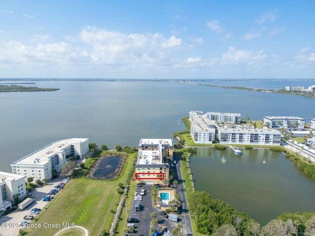 Aerial view highlighting the unit floor at Riverwest condo with pond and river views, Cocoa Beach, Florida
