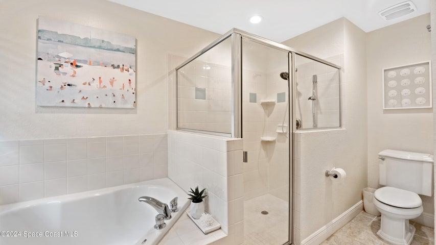 Primary Bathroom with Tub and Walk in Shower