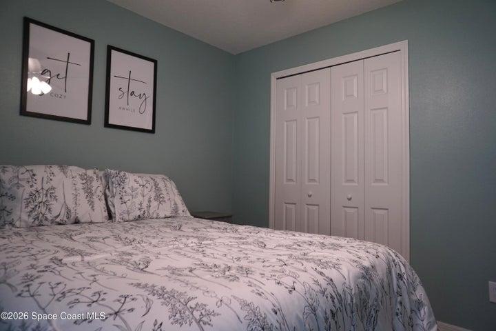 Bedroom 3 overlooks backyard.