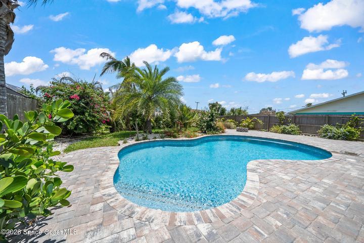 Huge 6' deep salt-water pool with lots of deck space for lounging and firepit area