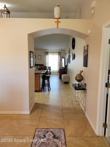 Foyer to open space kitchen and family room, dining room