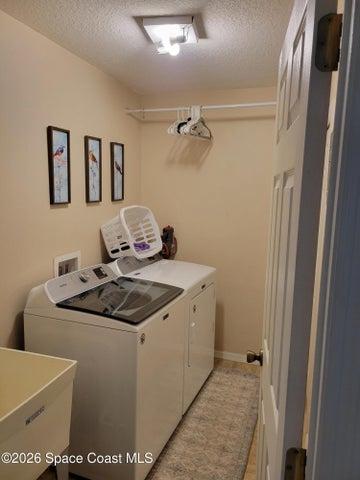 laundry room with wash bin.
