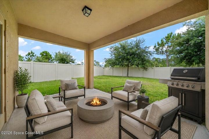 Virtually staged furniture & grill, not included