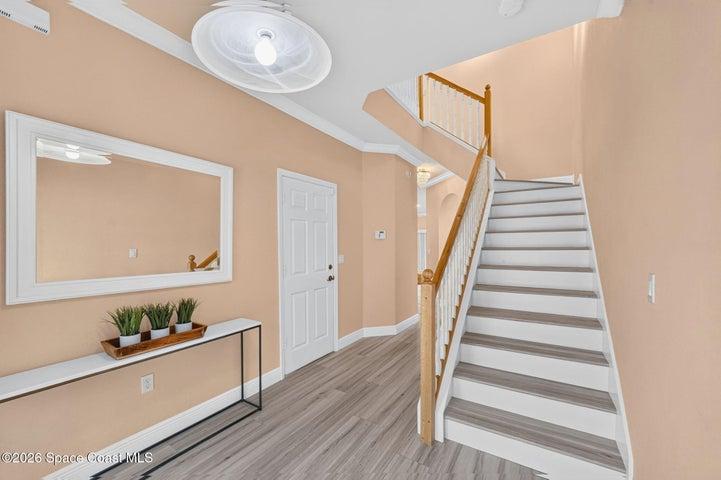 Stairs leading to the 3 bedrooms and 2 full baths.