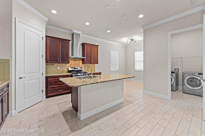 Indoor laundry room off of kitchen