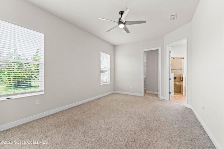 Large primary bedroom with his and hers closets