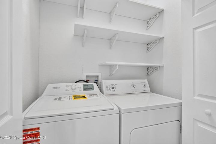 Convenient indoor laundry closet located downstairs