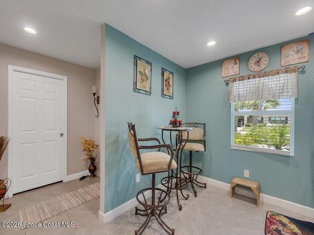 Interior space featuring tiled flooring and a window with natural lighting