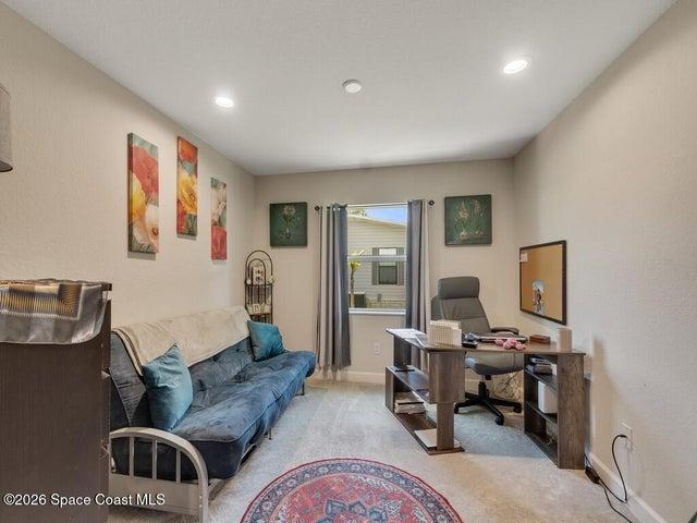 Versatile room featuring recessed lighting, a window with exterior views, light-toned walls, and carpet flooring