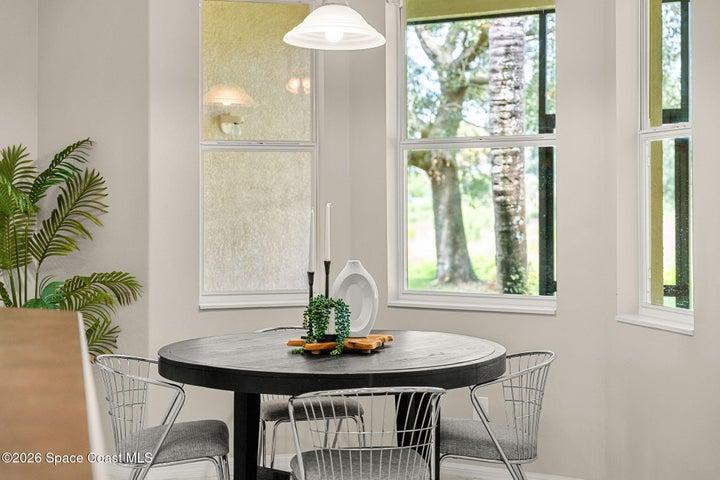 Eat-in kitchen area with view of backyard