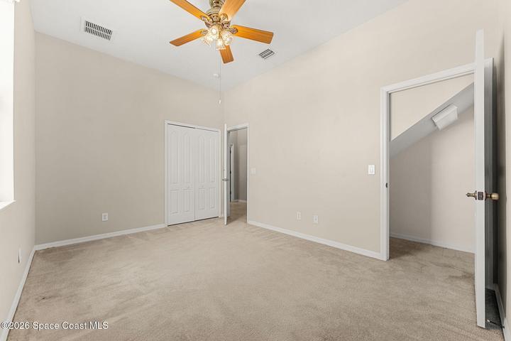 Bedroom with extra storage closet