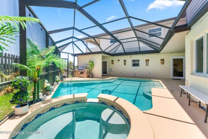 Hot tub and screened pool, natural gas heated, covered areas for patio furniture