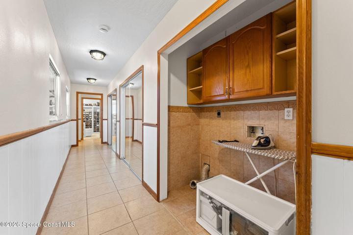 Reverse view of the second level hallway, washer dryer hookups (currently the washer/ dryer are located on the first level in the garage