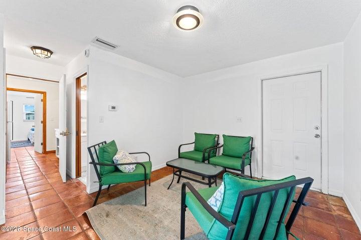 ADU room 1, second angle, has both slider to the pool area and separate entrance door to the side